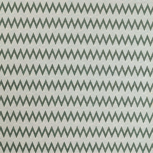 Pine green zigzag chevrons woven across a pale azul blue-grey fabric