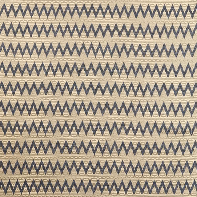 Storm-blue zigzags crossing a warm truffle-taupe woven ground