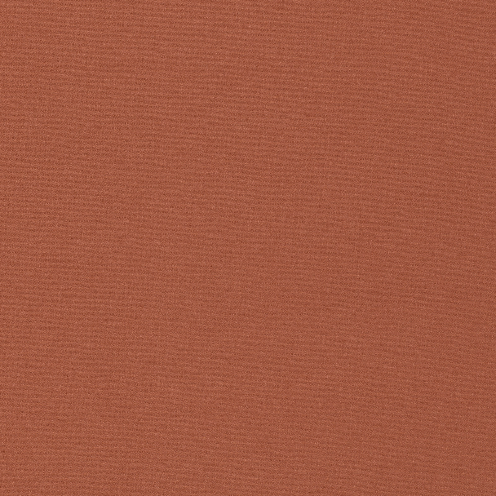 Close-up of warm burnt-terracotta fabric with a fine, even woven texture