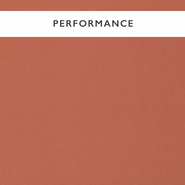 Dusty terracotta plain fabric with a fine, even woven texture
