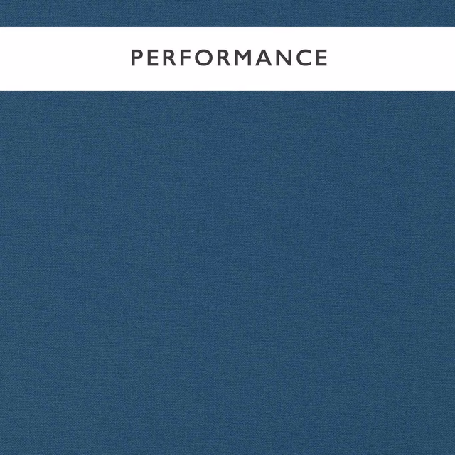 Close-up of cool denim-blue fabric with a fine, subtly textured woven surface