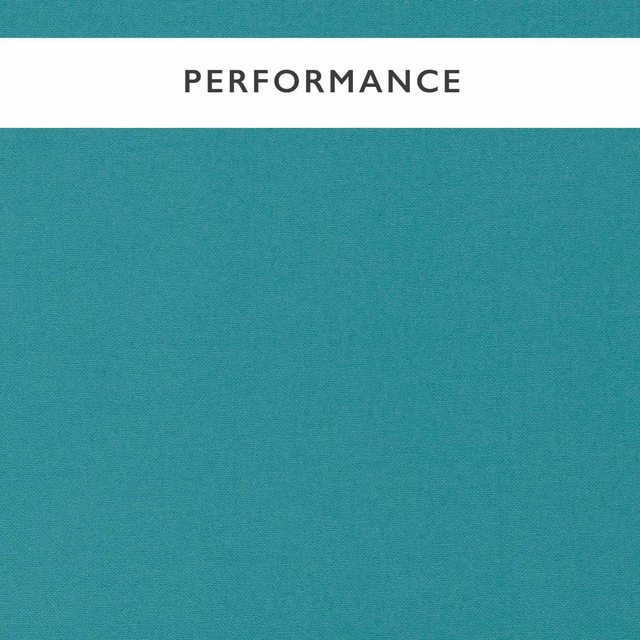 Close-up of muted lagoon teal fabric with a fine, even woven texture