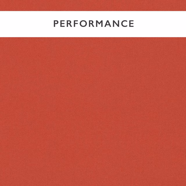 Close-up of deep scarlet red fabric with a fine, even woven texture