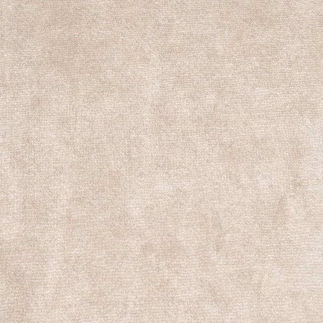 Close view of pale shell-beige velvet with soft, mottled nap variation