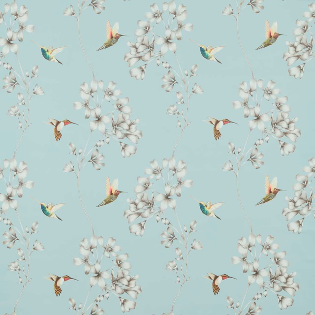 Pale aqua fabric with white blossom sprays and jewel-toned hummingbirds