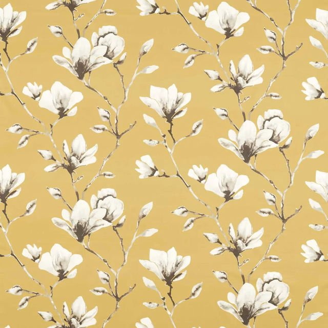 Ochre floral fabric with ivory magnolia blooms and delicate branching stems