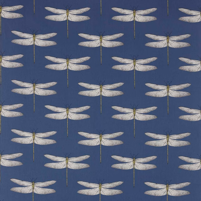 Pale dragonflies with chartreuse bodies repeated across a deep ink-blue textile