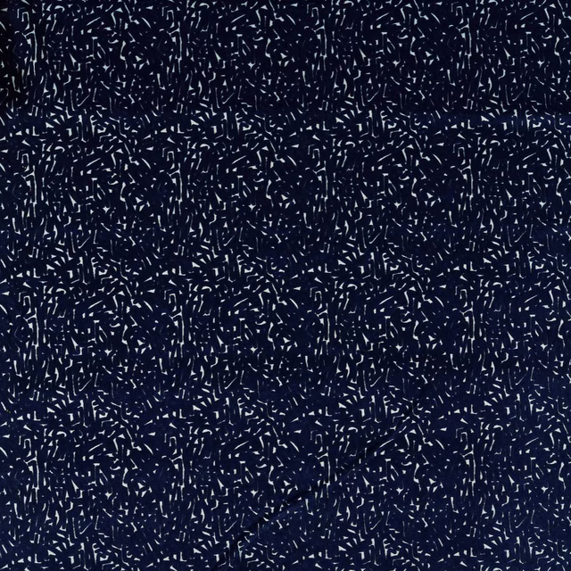 Deep ink-blue textile scattered with fine lagoon dashes and a softly textured surface