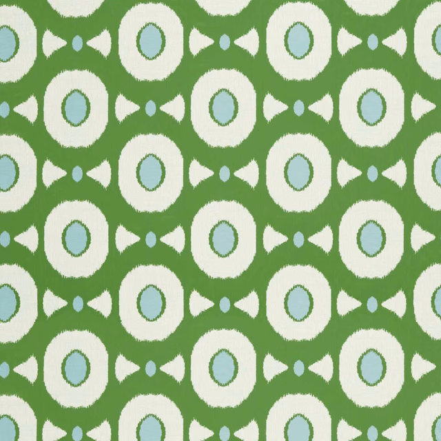 Emerald green geometric fabric with ivory rings and pale sky-blue centres
