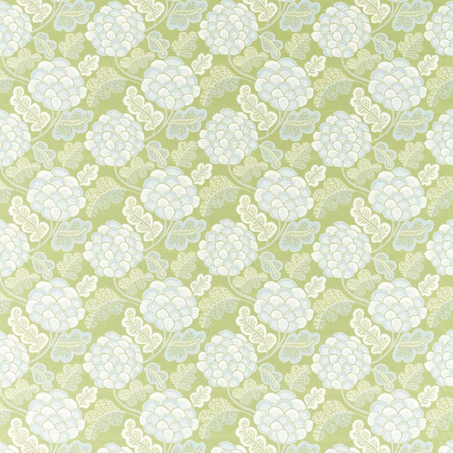 Pale sage-green fabric with white clustered florals and scrolling leaf motifs