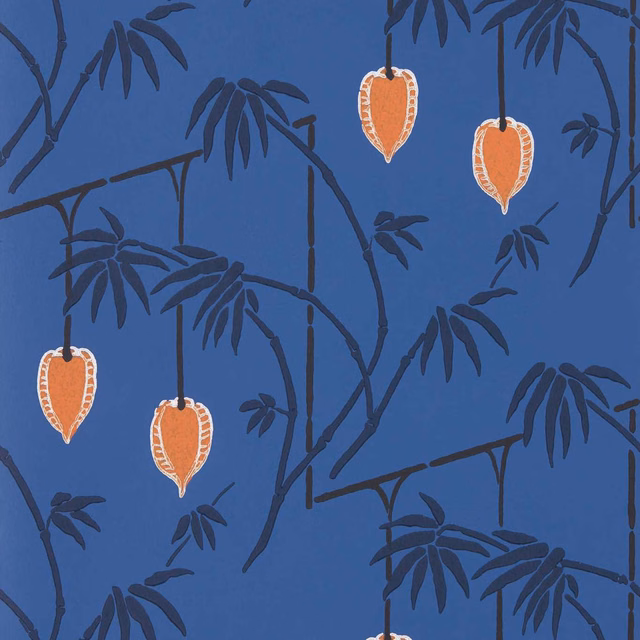 Deep cobalt wallpaper with charcoal bamboo branches and orange hanging botanical motifs