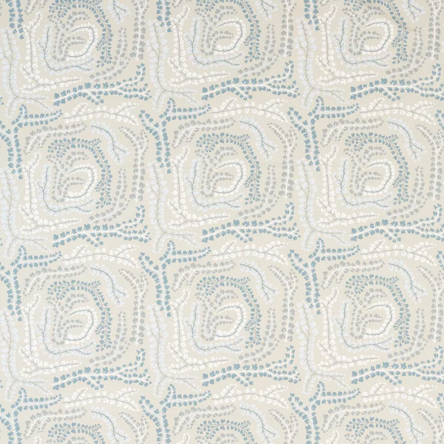 Pale cream textile with powder-blue dotted paisley squares and softly textured surface