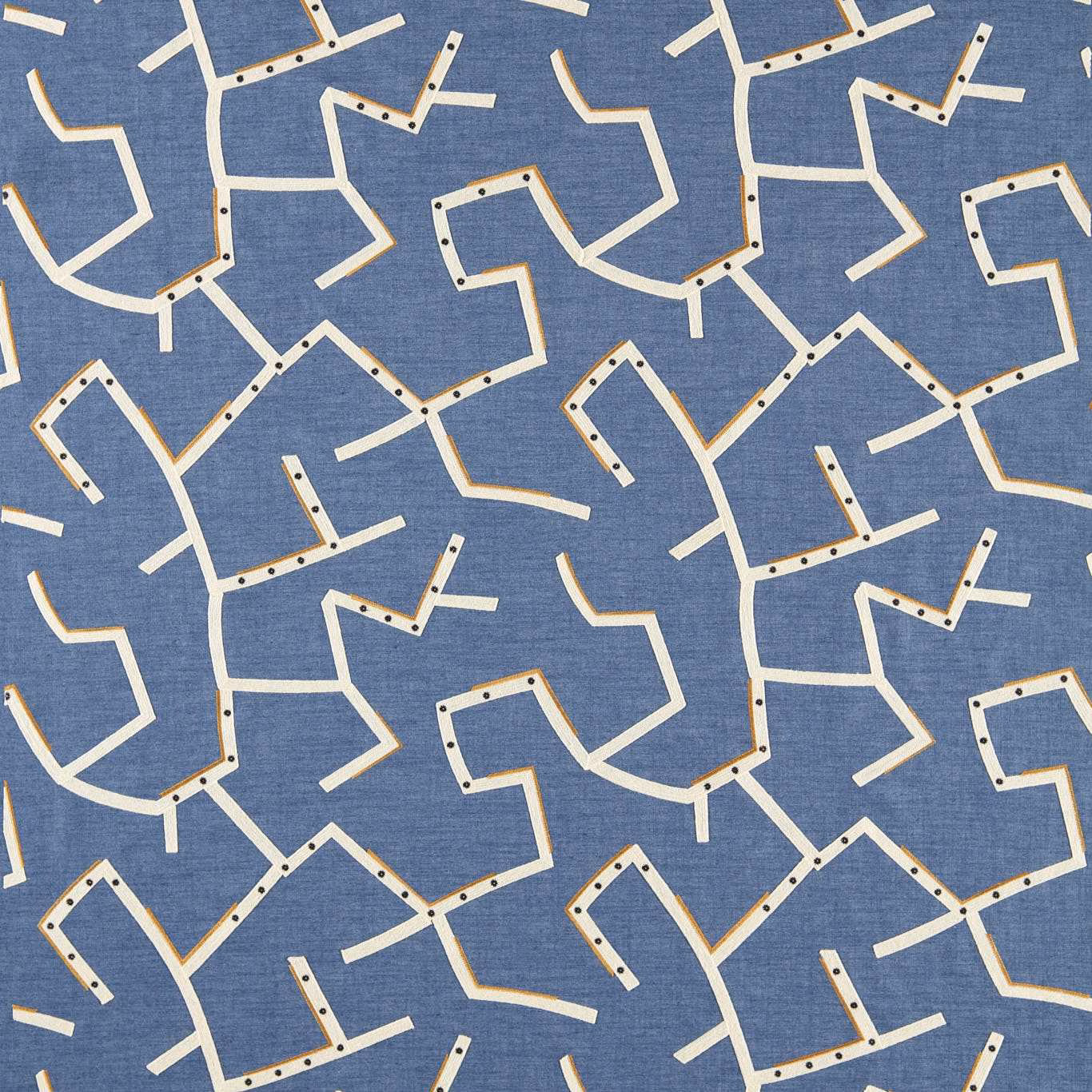 Cool denim-blue woven fabric with cream angular lines and dark dotted accents
