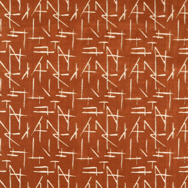 Burnt terracotta velvet with repeated ivory angular line motifs and dense textured surface