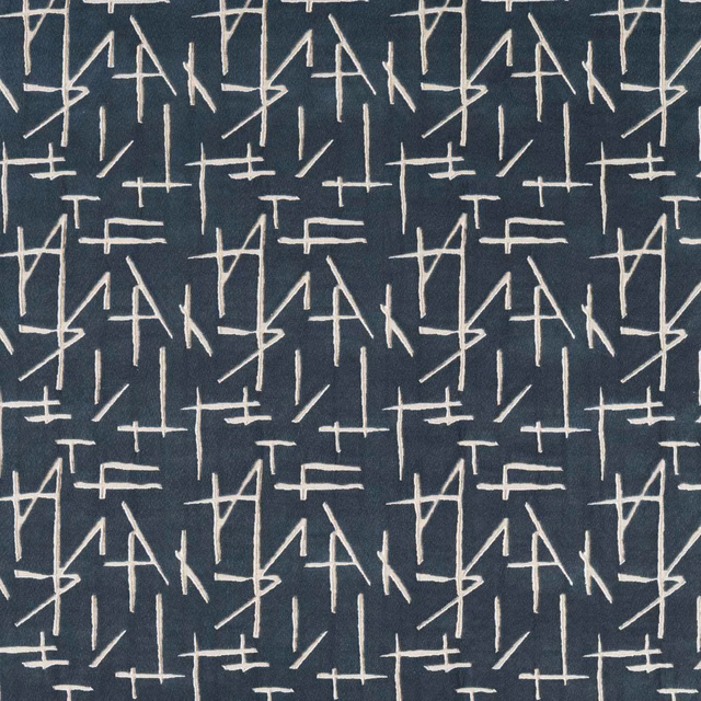 Midnight blue velvet with ivory angular line motifs and subtle pile sheen