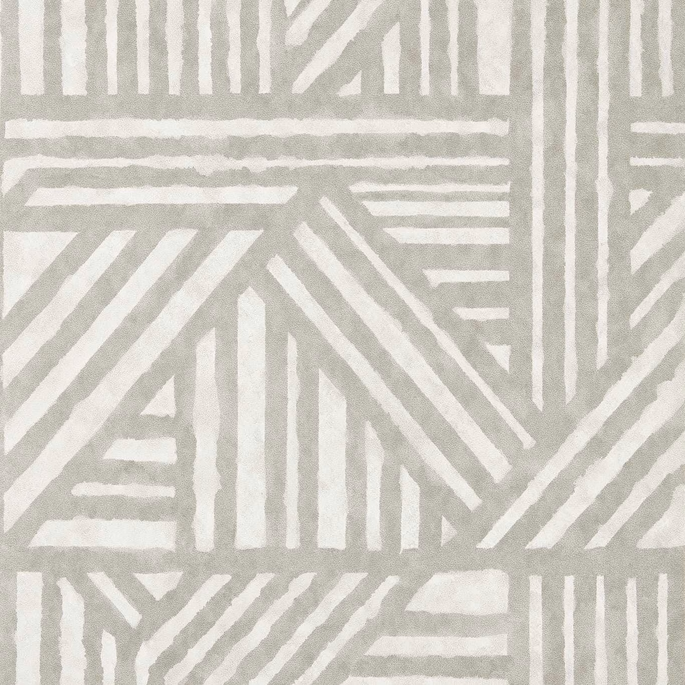 Cool slate-grey wallpaper with chalk-white angular stripes and irregular painted edges