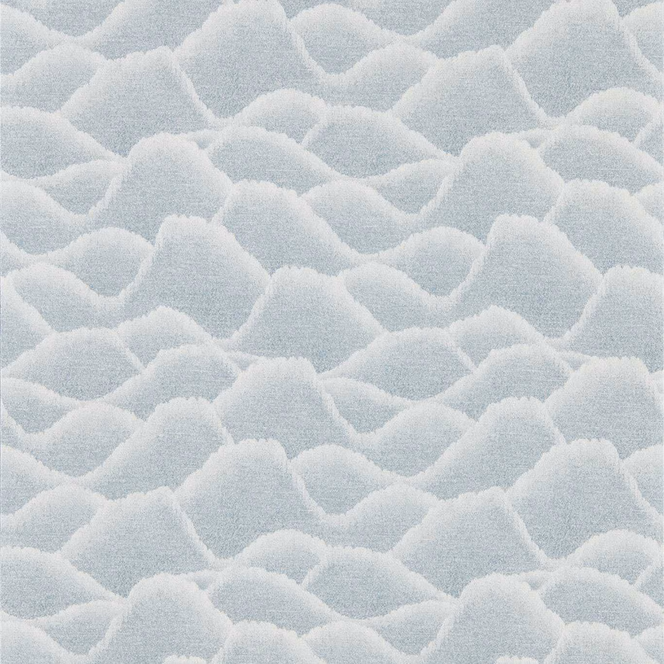 Pale blue-grey wallpaper with overlapping soft-edged cloud forms and fine grain