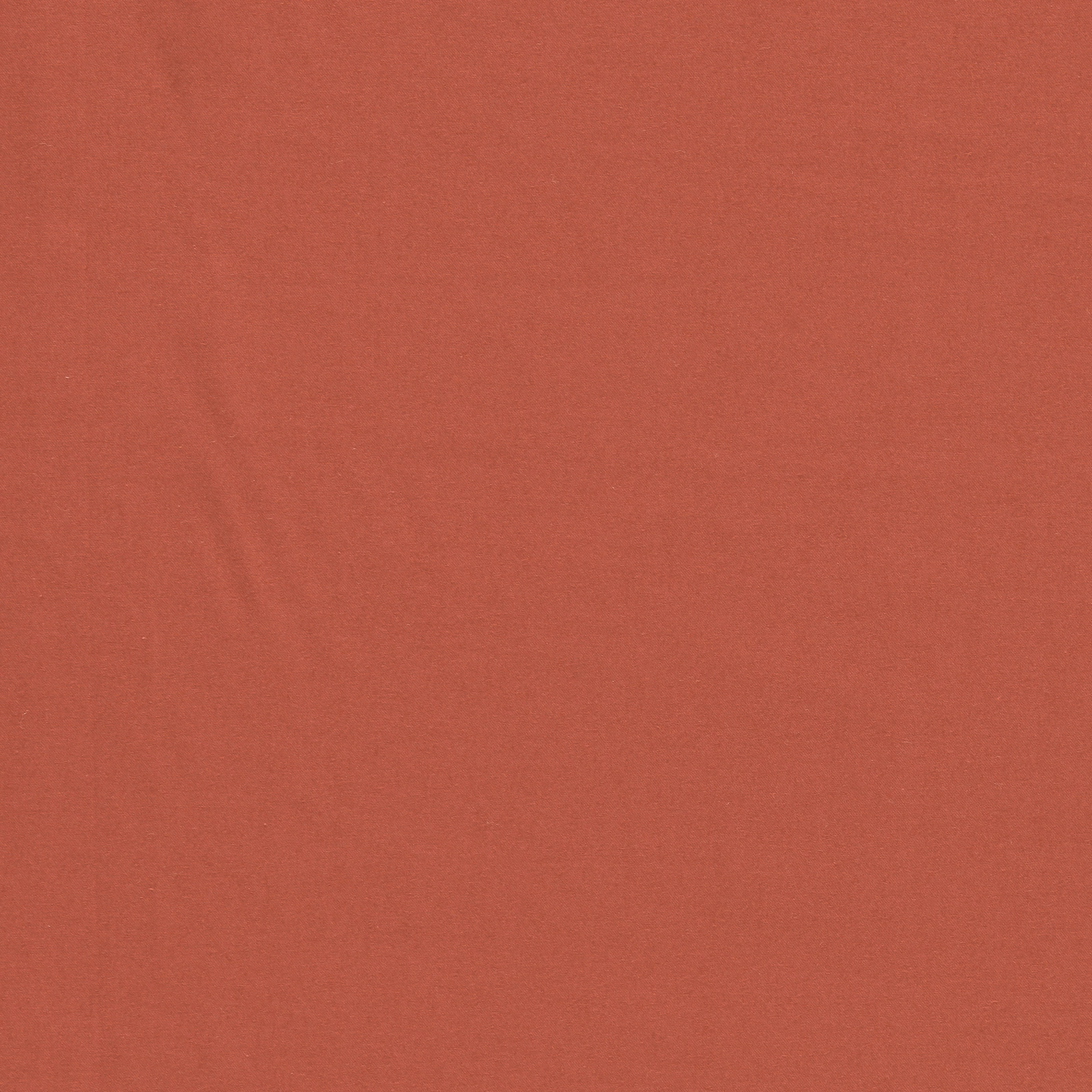 Muted coral plain textile with a fine, subtly textured woven surface