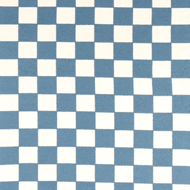 Muted Atlantic blue and ivory checkerboard with a softly tactile woven surface