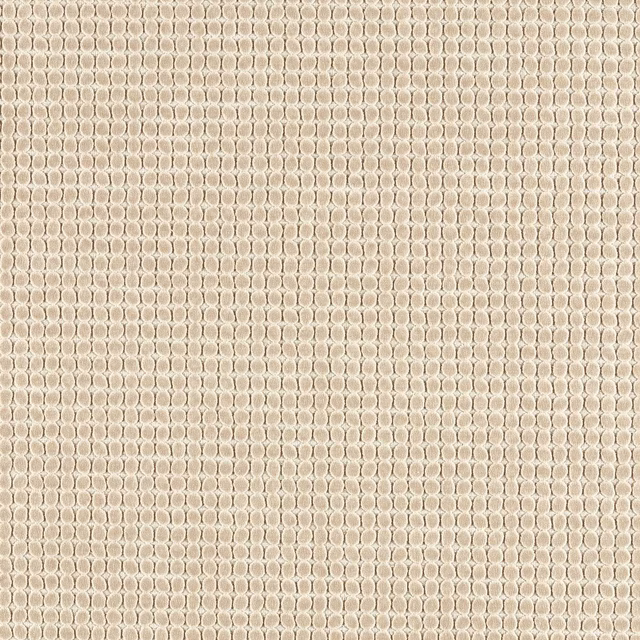 Oatmeal woven fabric with pale looped spots and a dense tactile surface