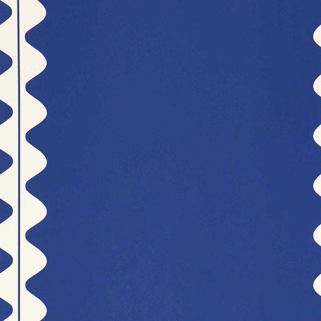Saturated lapis-blue wallpaper with ivory scalloped vertical bands and subtle surface variation