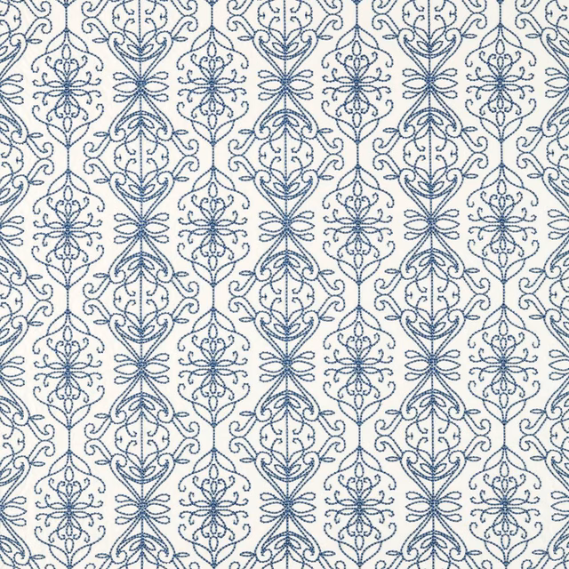 Denim-blue scrolling floral medallions aligned in vertical columns over a pearl linen-look ground
