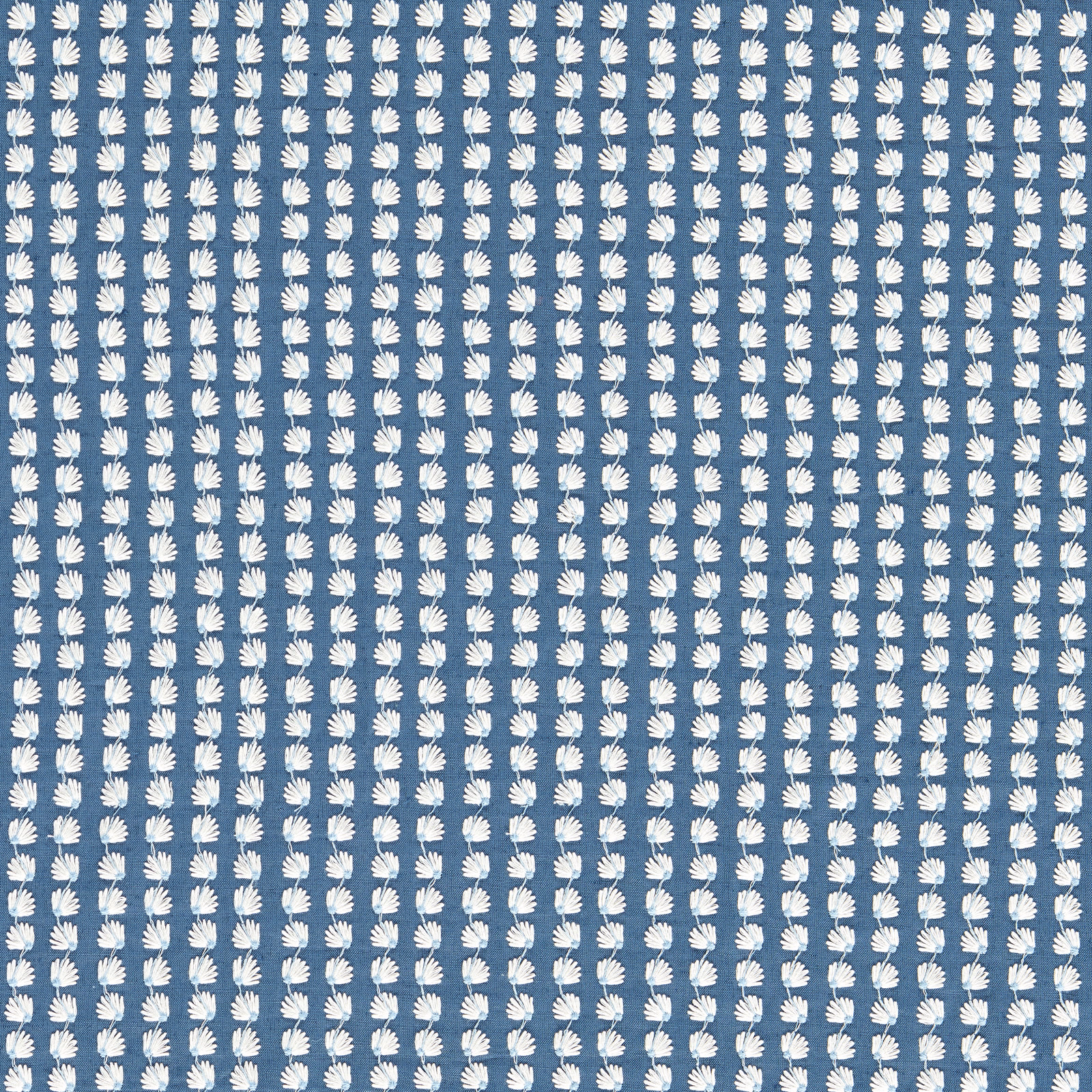 Denim-blue woven fabric with repeated white fan-shaped leaf motifs in vertical rows