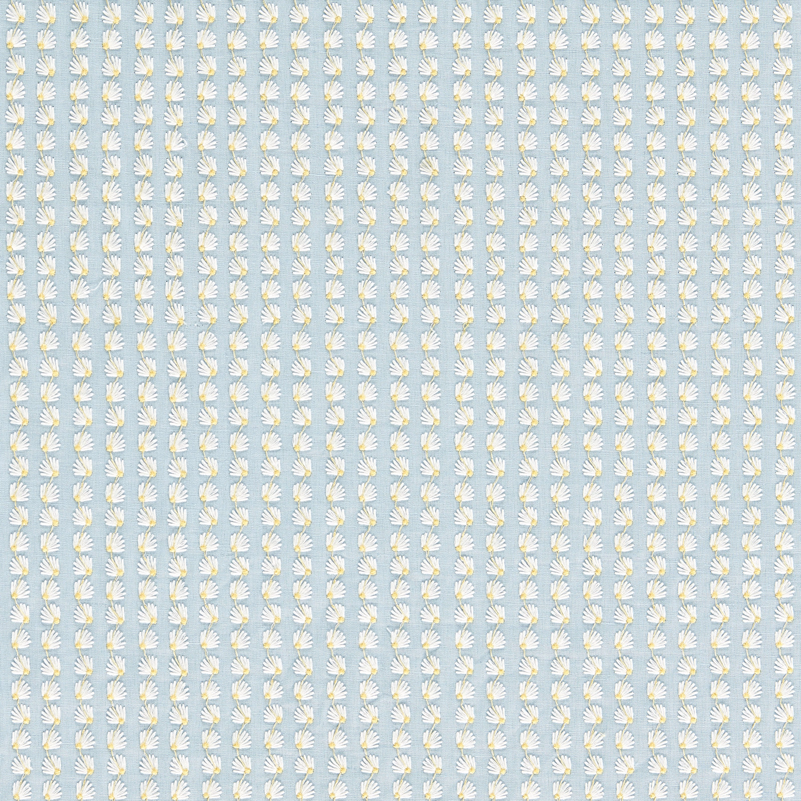 Pale sky-blue fabric with tiny white and honey fan-like floral motifs