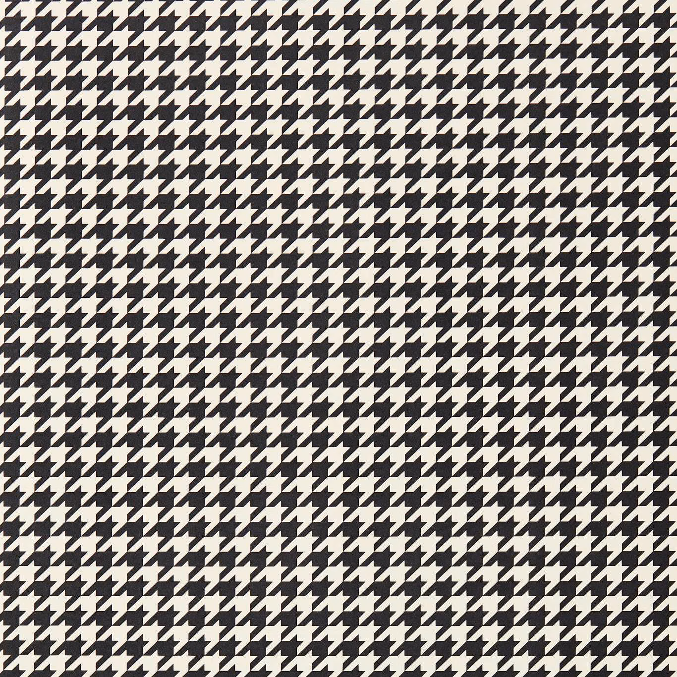 Dense black and soft ivory houndstooth wallpaper with a finely textured, graphic surface