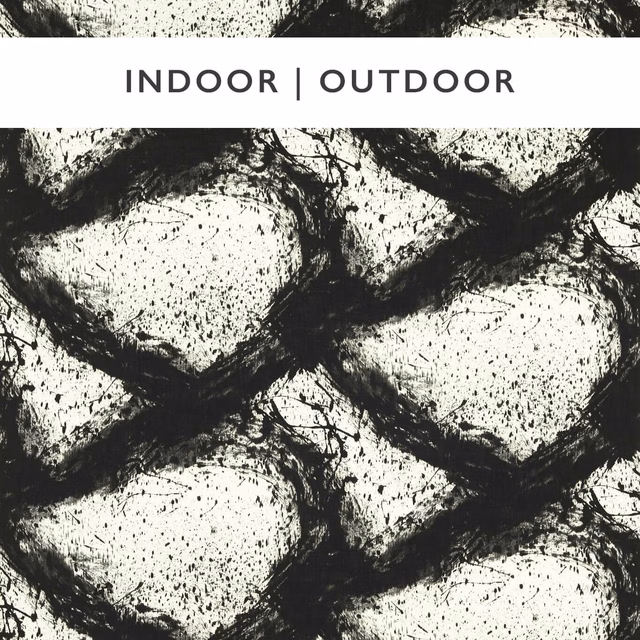 Black brushwork lattice over a speckled ivory ground in an outdoor fabric swatch
