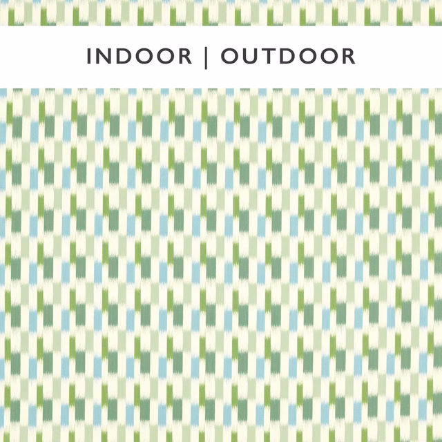 Small green, sky-blue and cream geometric marks on a finely patterned fabric