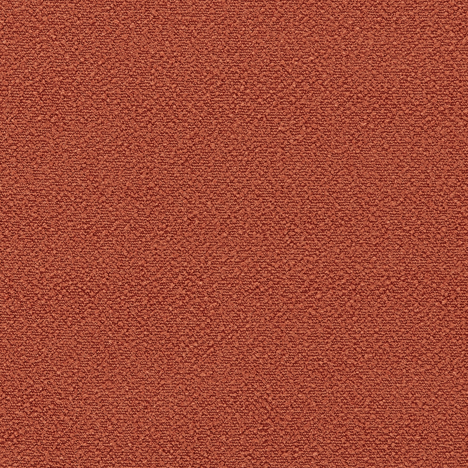 Close-up of muted rhubarb-red outdoor fabric with dense pebbled woven texture