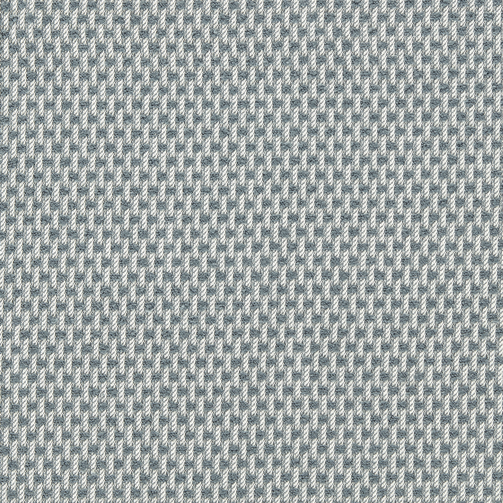 Close-up of pale celestial blue-grey and chalk flecked outdoor woven upholstery fabric