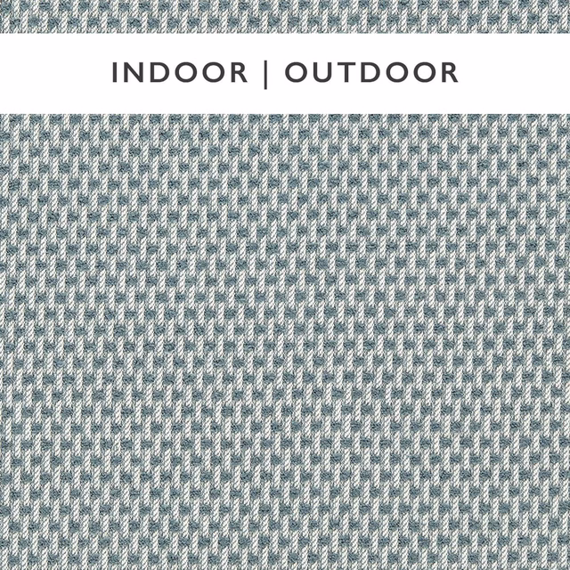 Close-up of pale celestial blue-grey and chalk flecked outdoor woven upholstery fabric