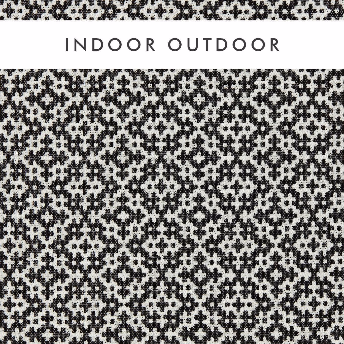 Black and chalk geometric woven fabric with dense, pixel-like medallions