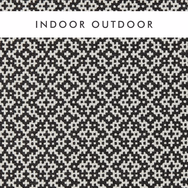 Black and chalk geometric woven fabric with dense, pixel-like medallions