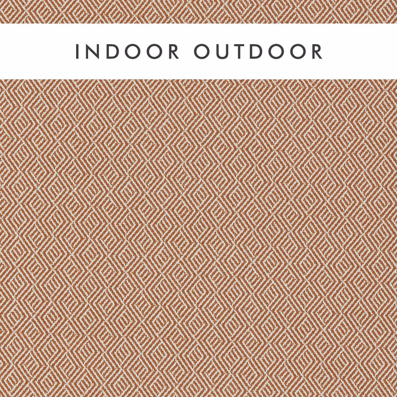 Warm rust and chalk woven fabric with a small interlocking diamond lattice