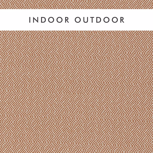 Warm rust and chalk woven fabric with a small interlocking diamond lattice
