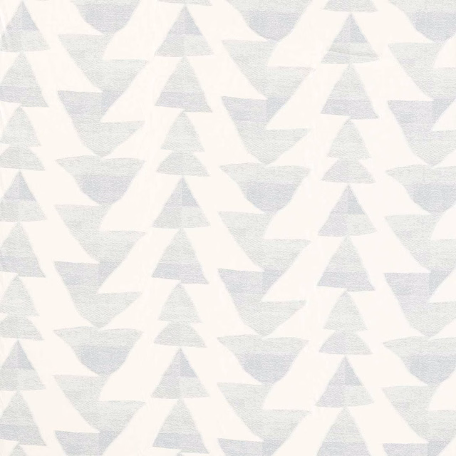 Pale sky blue-grey woven textile with cloud-white angular triangles and zigzags