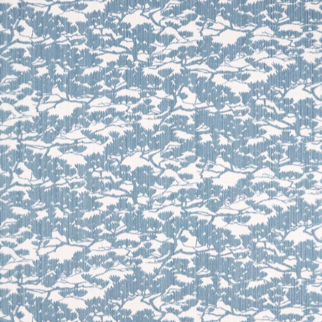 Cool denim-blue and ivory woven fabric with fine ribs and broken foliage motifs