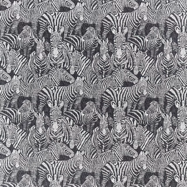 Charcoal and ivory zebra heads in a densely woven patterned fabric