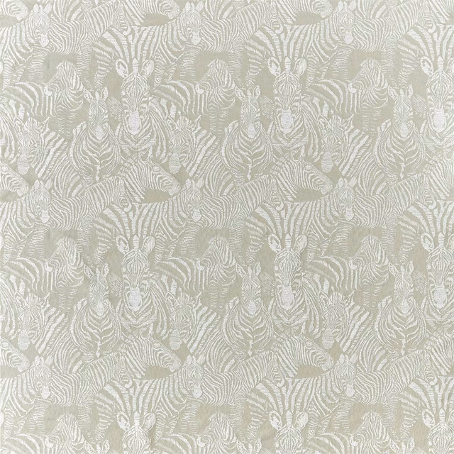 Pale greige woven fabric with repeated striped tiger faces and softly textured surface