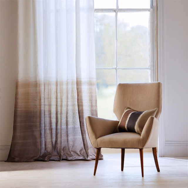 Sheer curtain fading from pale ivory to taupe-brown with fine vertical striations