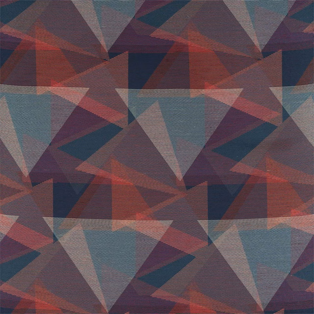 Ink, coral, teal and mauve geometric triangles in a softly textured woven swatch