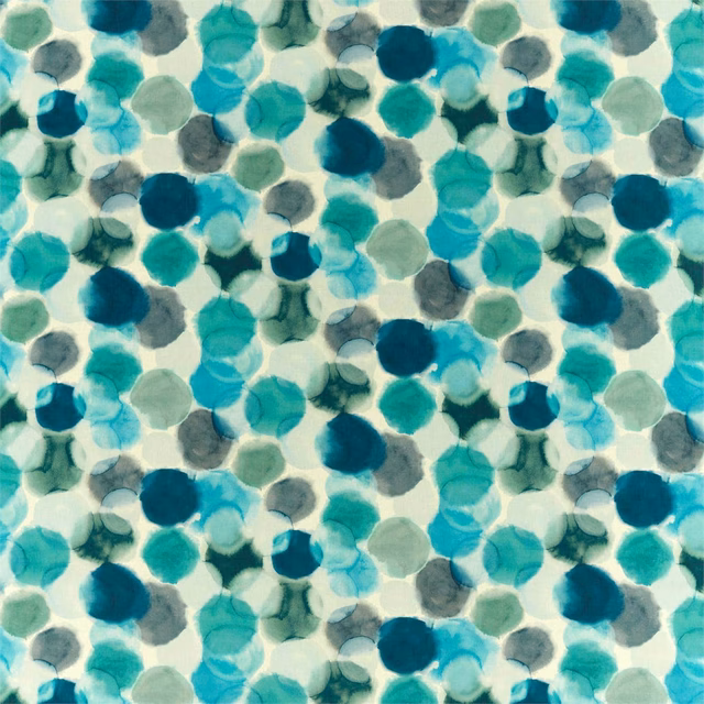 Teal, azure and ink pebble-like forms scattered across a pale aqua textile
