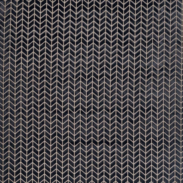 Deep graphite fabric with fine pale vertical chevron lines in a dense geometric weave