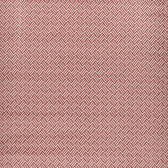 Muted rosewood fabric with pale interlocking chevrons and a finely textured surface