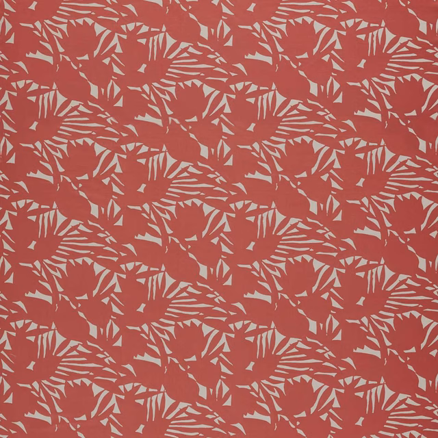 Muted rosewood-red fabric with pale fan-shaped botanical leaves in a dense repeat