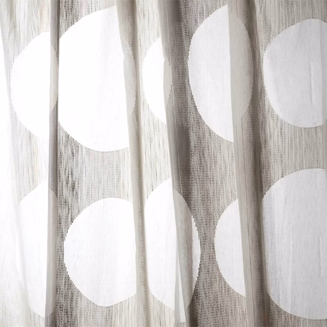 Taupe-grey translucent weave with oversized off-white circles in vertical folds