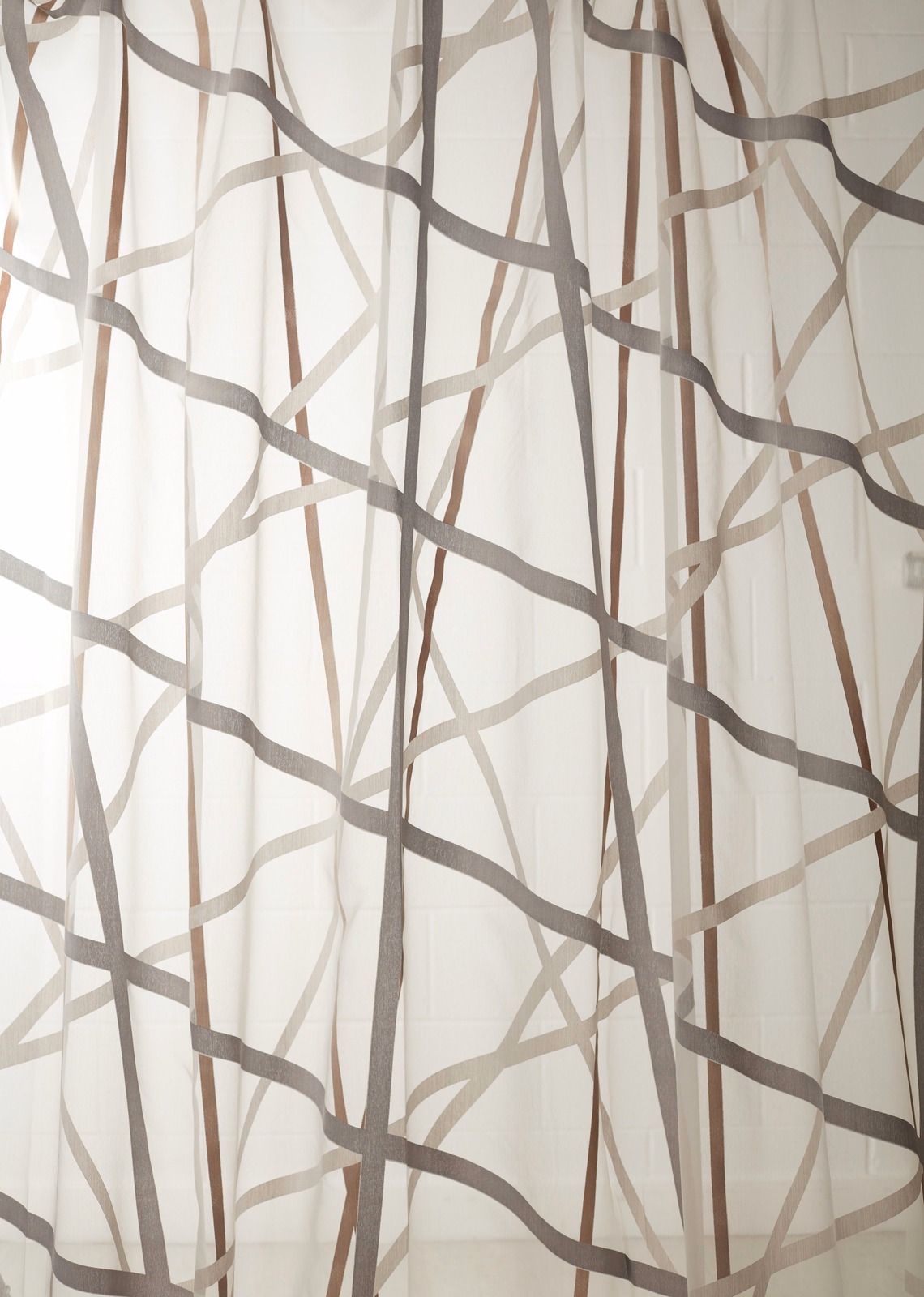 Ivory sheer with intersecting graphite and bronze linear trails